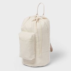 This Canvas Backpack Laundry Bag from Brightroom™ offers a convenient and clever way to carry and store your laundry. This cream-color canvas laundry bag has a classic backpack silhouette with a spacious main compartment featuring a drawstring closure and a zippered pocket at the front. Thanks to the top loop handle and adjustable shoulder straps, you can haul your laundry easier than ever. Brightroom™: See your space in a new light. Embroidered Laundry Bag, Unc Dorm, Room Shuffles, Target Dorm, Laundry Backpack, School Necessities, Collage Dorm, College Shopping, Dorm Shopping