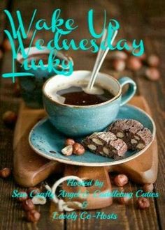 a cup of coffee and some cookies on a wooden table with the words wake up wednesday hank