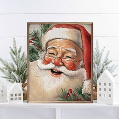 a painting of santa claus on top of a mantel with christmas greenery and small white houses