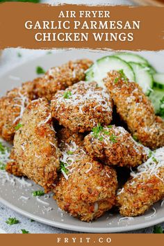 fried garlic parmesan chicken wings on a plate with cucumbers