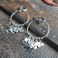 "Handmade sterling silver earrings - hoops with leaves. It is available with either raw (unpolished) or polished silver finish - the photo shows polished earrings. Rim diameter - 1\" (2.5 cm). Length of earrings - 2.5\" (6 cm). You can choose your favorite type of fastener from the following options: hoop, leverback, hook and stick. We recommend a bracelet and a necklace to complete the set. We send jewelry in an elegant box. Thank you for visiting Treendystudio!" Hoop Earrings With Dangles, Silver Hand Forged Dangle Hoop Earrings, Silver Dangle Hoop Earrings Hand Forged, Hand Forged Small Hoop Silver Earrings, Silver Hand Forged Small Hoop Earrings, Silver Hand Forged Hoop Earrings, Handmade Silver Earrings, Native American Bracelets, Earrings Hoops