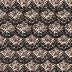 an intricate black and white pattern on fabric