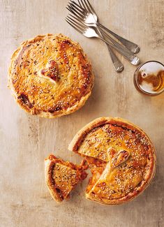 two pies on a table with one slice missing