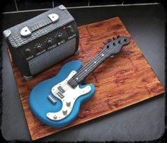 a cake shaped like a guitar and amp