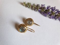 Handmade, antique style labradorite earrings, made of 14k gold plated brass. The labradorite gemstone is beautiful and keeps changing colors from green to blue. Please note that the stone is natural and therefore each one can be slightly different from the other or from the picture above. These labradorite earrings are a perfect holiday gift for her and great bridal earrings. Dimensions: The green earrings drop length is 1 inch. The labradorite earrings size is 1x1 cm (0.4x0.4 inches) The labrad Elegant Labradorite Drop Earrings, Elegant Handmade Labradorite Earrings, Gold Earrings Bridal, Green To Blue, Gemstone Earrings Gold, Earrings Antique, Labradorite Earrings, Earrings Drop, Green Earrings