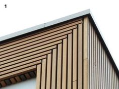 the side of a building with wooden slats on it