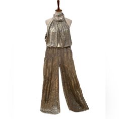 Ny&Co Metallic Halter Neckline Wide Palazzo Pants Jumpsuit Sz L Condition: Preowned Gently Worn Once Impeccably Kept Please Check Closely Photos For Details And Measurements Of The Item Listed As They Are Pictures Of The Piece You Will Receive . I Do Not Use Stock Photos -Fast Shipping - First Owner - Smoke And Pets Free Environment All Items ( Except New With Tags ) Are Dry Cleaned, Laundered, Or Dust /Shine / Etc Fully Cleaned Prior To Shipping. Summer Wide-leg Pantsuit For Party, Spring Party Overalls, Summer Party Stretch Pantsuit, Summer Stretch Pantsuit For Party, Spring Party Pantsuit Overalls, Spring Party Overall Pantsuit, Chic Gold Jumpsuits And Rompers For Party Season, Sleeveless Gold Jumpsuits For Spring, Gold Jumpsuits And Rompers For Summer Evenings