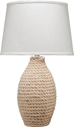 a white table lamp with a roped design on the base and a linen shade