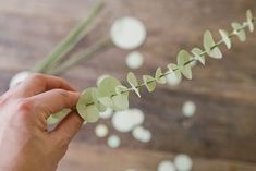 someone is cutting paper hearts on a string