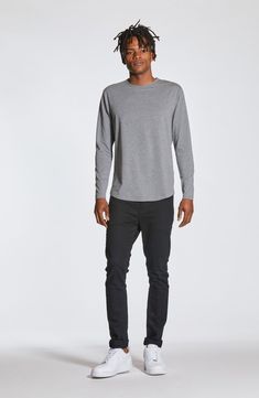 Made from a soft cotton blend, a versatile long-sleeve T-shirt enhanced with a curved hem is an instant closet favorite that looks great alone or layered. Crewneck Long sleeves 62% polyester, 33% cotton, 5% spandex Machine wash, tumble dry Imported Casual Long Sleeve Top With Shirttail Hem, Fall T-shirt With Shirttail Hem, Casual Long Sleeve Top With Shirttail Hem For Layering, Curved Hem Tops For Fall Layering, Casual Cotton Long Sleeve Top For Layering, Casual Tops For Layering With Curved Hem, Relaxed Fit Top With Curved Hem For Fall, Casual Tops With Curved Hem For Fall, Basic Cotton Long Sleeve Top For Layering