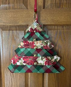 a christmas tree shaped ornament hanging on a door