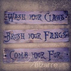 three wooden signs that say wash your claws, brush your fangs and come your fur