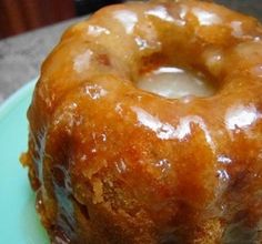 a glazed donut sitting on top of a blue plate