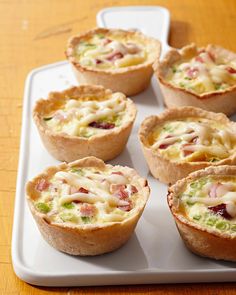 small quiche cups on a tray ready to be eaten