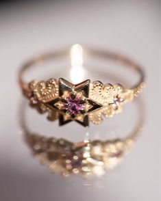 ✪ Limited Edition. The most delicate and finely detailed pink sapphire & diamond ring. Designed with elements of the six pointed Star of Saturn, as a symbol of guiding light, and a talisman of spiritual forces. ✧ Stack The North Star with Supernova ✧ 14K Solid Yellow Gold, 1.2mm Band ✧ 3mm Natural Pink Sapphire Center ✧ 1.5mm Round Brilliant Side Sapphires ✧ Conflict Free with Fair Trade Gold ✧ Hand textured details ✧ Made in the USA Nora Sermez, Star Wedding Ring, Star Engagement Ring, Six Pointed Star, Star Rings, Alchemy Jewelry, Dope Jewelry Accessories, Star Sapphire Ring, The North Star