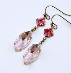 "These elegant handmade earrings feature shimmering light rose pink faceted navette crystals accented with lovely Swarovski dark pink square crystals. These earrings measure approximately 1 3/4\" long end to end (from top of ear wire to base of navette crystal). Solid antique brass french hook wires are beautifully aged and are lead and nickel safe. Crystal are set in hand antiqued solid brass settings. All jewelry arrives in a complimentary decorative cardboard gift box, ready for gift giving. Swarovski Drop Earrings, Blush Pink Earrings, Pink Dangle Earrings, Victorian Style Earrings, Pink Crystal Earrings, Mood Jewelry, Pink Square, Bridesmaid Gifts Jewelry, Earrings Bridesmaid