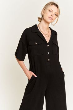 A shirt jumpsuit featuring a basic collar, button-front closures, chest flap pockets, front and back patch pockets, dropped short sleeves, and wide leg.-Button Closure Jumpsuit-Wide leg-Side Flap Pocket-CollarPLUS : 1X-2X-3X (2:2:2)REG: S-M-L-XL (2:2:2:2)*PLUS Size is available*Made In: MADE IN CHINAFabric Contents: "65%COTTON35%POLYESTER" Casual Short Sleeve Relaxed Fit Jumpsuits And Rompers, Casual Short Sleeve Jumpsuits And Rompers With Relaxed Fit, Casual Jumpsuits And Rompers With Short Sleeve, Relaxed Fit, Cotton Short Sleeve Jumpsuits And Rompers With Button Closure, Casual Collared Jumpsuits And Rompers With Relaxed Fit, Relaxed Fit Jumpsuits And Rompers With Short Sleeves, Casual Short Sleeve Jumpsuits And Rompers For Loungewear, Short Sleeve Jumpsuits And Rompers With Pockets For Loungewear, Casual Collared Cotton Jumpsuits And Rompers