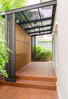 an outdoor deck with wooden steps and metal railing