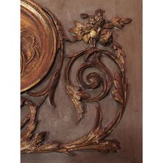 an intricately carved wood panel with flowers and leaves