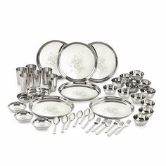 an assortment of silverware and utensils on a white background, including dishes