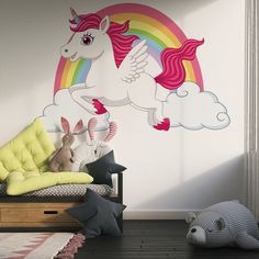 a child's room with a unicorn wall decal