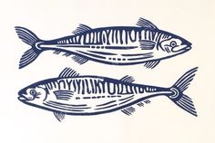 two fish that are standing next to each other on a white surface with blue ink