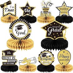 graduation decorations with black and gold ribbons, stars, and congratulationss on them for the graduate's day