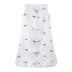 a white shirt with dragonflies on it hanging from a clothes line, and the top is