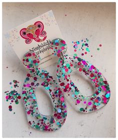 there is a pair of scissors made out of confetti