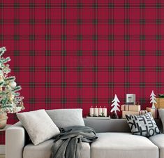 a living room decorated for christmas with plaid wallpaper