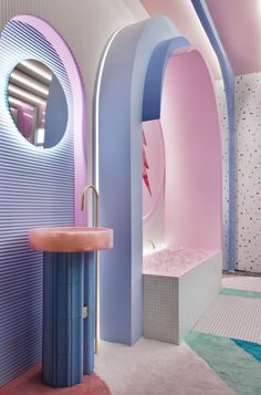 a bathroom with pink, blue and white walls in the shape of arch doorways