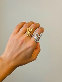 Embrace elegance with our 14K Gold Snake Ring, a stunning blend of mystique and luxury. Whether you prefer the radiant shine of 14K gold plating or the sleek sophistication of sterling silver, this adjustable Snake Wrap Ring is a unique and timeless piece. The design features a coiled snake, symbolizing transformation and power, making it a striking statement accessory. Crafted with meticulous attention to detail, the open style allows for easy adjustment, ensuring a comfortable fit for any fing Luxury Snake-shaped Wedding Ring, Silver Tarnish Resistant Diamond Ring For Promise, White Gold Snake Ring With Diamond Accents For Gift, White Gold Snake Ring With Diamond Accents As Gift, Silver Tarnish-resistant Diamond Ring For Promise, Yellow Gold Diamond Ring In Snake Shape, Fine Jewelry Silver Snake-shaped Ring, Fine Jewelry Silver Snake Shape Ring, Silver Snake Shape Fine Jewelry Ring