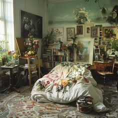 a bed in a room with lots of flowers on the wall and pictures on the walls