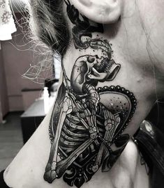 a woman with a skeleton tattoo on her neck