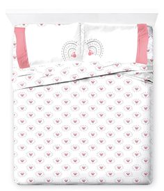 an image of a bed with pink and white sheets