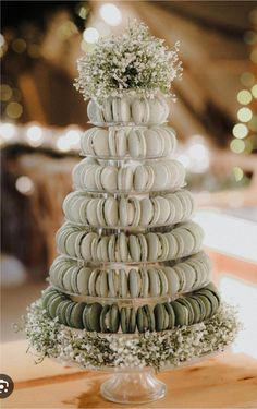 a wedding cake made out of macaroni and cheese on top of a wooden table