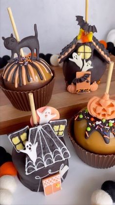 halloween cupcakes decorated with chocolate and spooky decorations