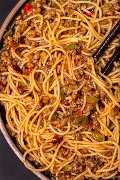 a pan full of spaghetti with meat and vegetables