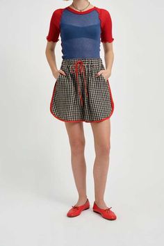 The bailey short is making a summer comeback with a quirky twist on the classic running short. these gingham oversized high-waisted shorts feature a drawstring for adjustable comfort and deep pockets for all your essentials. the curved hemline adds a flattering touch to the style and is piped in bold red linen    - 55% linen 45% cotton    - baggy mid-thigh length short    - elastic waist with adjustable drawstring at the front    - wash in cool water and hang to dry    - made in canada Tartan Shorts, Gingham Linen, Running Short, Sweater Jumpsuit, Linen Short, Ruched Dress, High Waisted Shorts, Fabric Care, Jumpsuit Dress