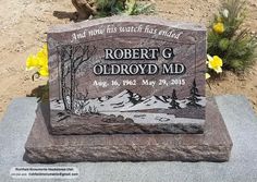 a memorial stone with the name robert g oldbroydd mid on it in front of some yellow flowers