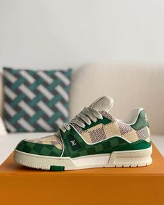 Embrace iconic style with a contemporary twist in these Louis Vuitton Trainer-inspired sneakers. The classic low-top silhouette is reimagined with a vibrant green and white colorway, featuring the signature Damier canvas for a touch of luxury. Crafted with meticulous attention to detail, these sneakers offer a premium look and feel, perfect for those seeking a statement piece that seamlessly blends streetwear edge with high-fashion inspiration. Trendy Green Leather Sneakers, Modern Green High-top Sneakers With Round Toe, Designer Green Lace-up Sneakers, Modern Green Sneakers With Rubber Sole, Modern Green Lace-up High-top Sneakers, Trendy Green Low-top Custom Sneakers, Modern Green High-top Sneakers With Rubber Sole, Modern Green High-top Sneakers With Abzorb Midsole, Modern Green Lace-up Custom Sneakers