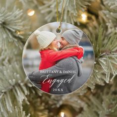 a christmas ornament hanging on a tree with the words, our first christmas