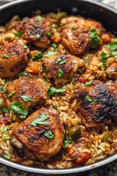 chicken and rice dish in a pan with parsley garnishes on top