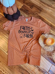 Faith Family Farm design on a comfy t-shirt. Additional shirt colors and long sleeves available upon request (price increase for long sleeves). Soft-washed Tri-blend Fall T-shirt, Fall Soft-washed Tri-blend T-shirt, Brown Screen Print Top For Fall, Pre-shrunk Orange Long Sleeve Tops, Brown Graphic Print Shirt For Fall, Soft-washed Tri-blend Fall Tops, Fall Custom Print Shirt With Relaxed Fit, Fall Season Relaxed Fit Shirt With Custom Print, Orange Pre-shrunk Long Sleeve T-shirt