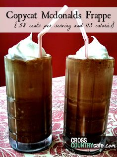 two glasses filled with ice cream sitting on top of a table