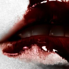 a woman's lips with blood on them