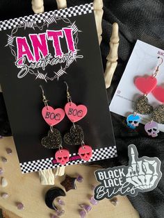 "Boo Valloween Dangles - Black Lace Brides Approx 3.5\" long Pink BOO Ghost Heart  Black Glitter HAUNT ME Heart   Pink Skull Silver Gold Earring Hook All earrings are made with gold plated sterling silver hooks. Nickle Free. PLEASE SHARE! :) & Let's Be Friends! IG: BlackLaceBrides IG: Black.Lace.Designs USE: #BlackLaceBrides  DM / TAG to be features" Ghost Heart, Resin Printing, Silver Gold Earrings, Lace Designs, Lace Bride, Boo Ghost, Pink Skull, Earring Hook, Gold Earring