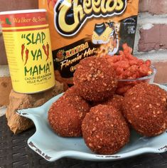 some food is on a plate next to a can of cheetos