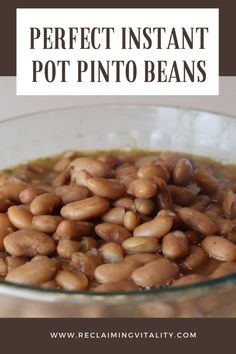 a bowl filled with beans sitting on top of a table