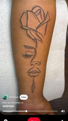 a woman's leg with a rose tattoo on the left side of her arm